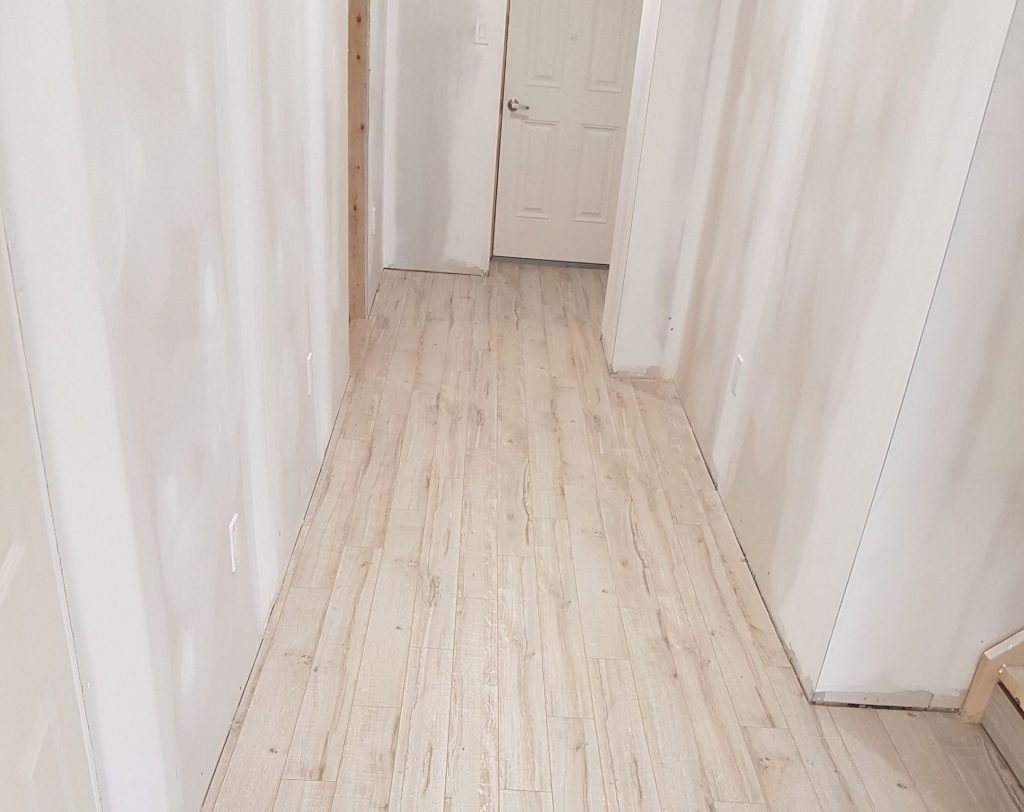 custom basement hallway with new floor - flooring installers toronto